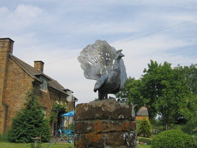 Ornamental peacock. On of the PEACOCK figures adorning the posts at the 187172.