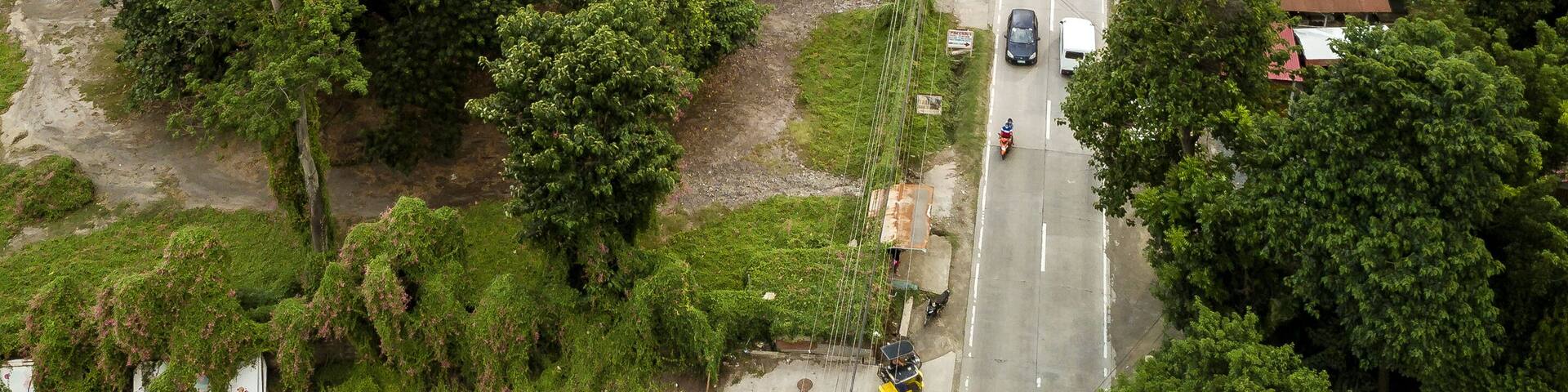 Aerial of Talisay - Tanauan road, with Taal volcano in the background.