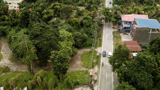 Aerial of Talisay - Tanauan road, with Taal volcano in the background.