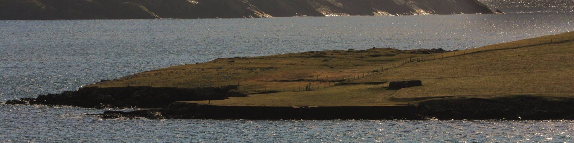 Levenwick Ness and distant No Ness in the morning light.