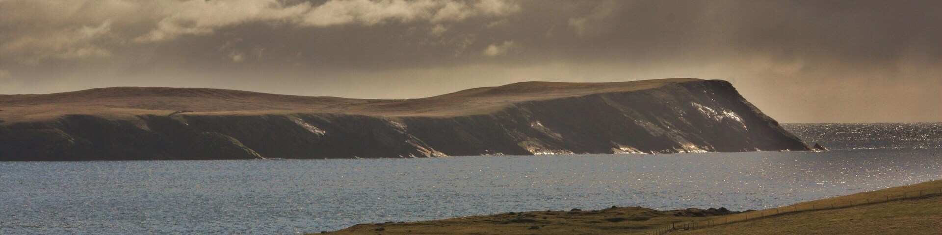 Levenwick Ness and distant No Ness in the morning light.