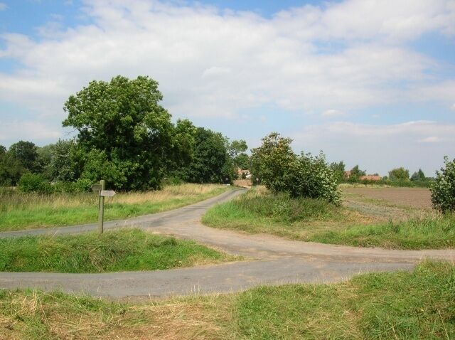 Near Upper Dunsforth Ahead is Upper Dunsforth, behind a footpath runs to Great Ouseburn which is also accessed via the road to the left, on the right there is a track running into some fields near the Ure.