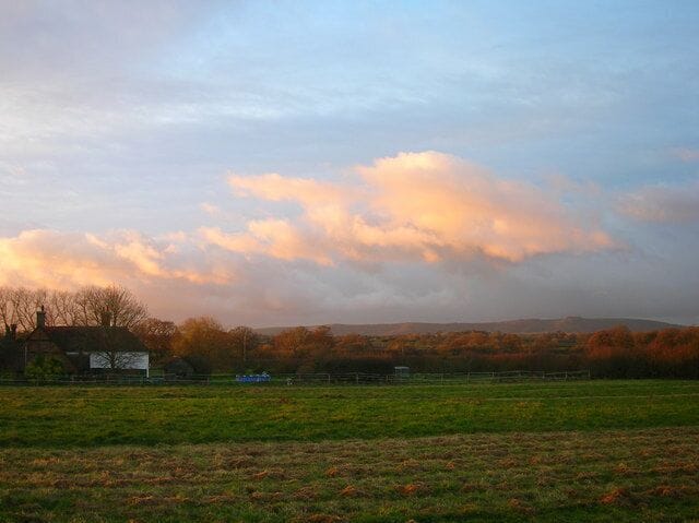 Lloyts Farm at Sunrise. The rear view of 268347 taken from the footpath that links Partridge Green to the River Adur. The South Downs can be seen in the distance with the distinctive crown of Chanctonbury Ring to the right.