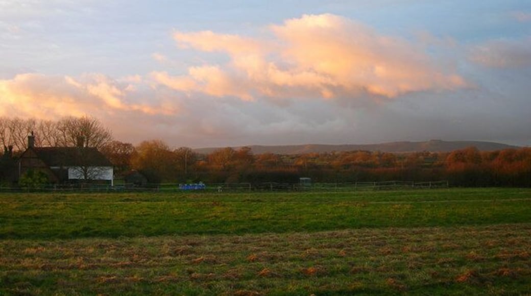 Lloyts Farm at Sunrise. The rear view of 268347 taken from the footpath that links Partridge Green to the River Adur. The South Downs can be seen in the distance with the distinctive crown of Chanctonbury Ring to the right.