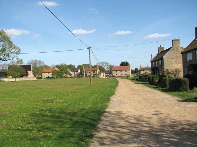 The village green. Beachamwell is a small village west of Swaffham. Many prehistoric tools, Saxon jewellery and Roman coins have been unearthed in the area and there are also the remains of two medieval crosses bearing witness to regular markets having taken place on the village green and at the crossroads. There once used to be four churches of which only one, St Mary's > 1269098 remains intact. Until the 1960's almost all the villagers were employed by the estate.