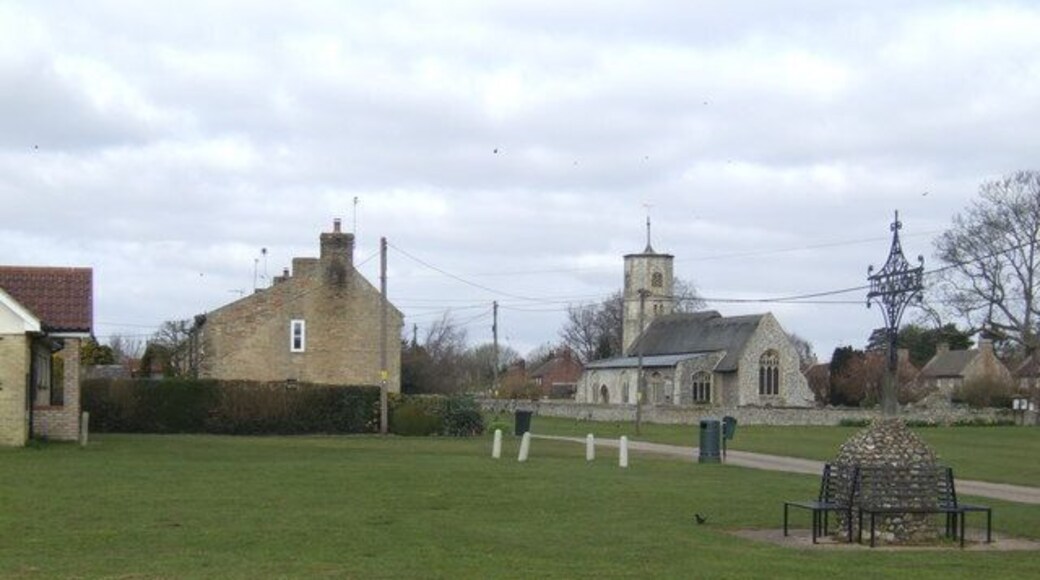 The village green, Beachamwell Featuring an elaborate wrought-iron village sign.