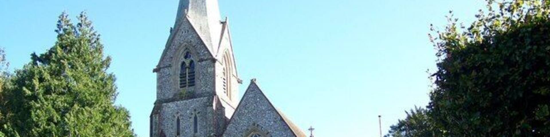 A church with a tall steeple and Gothic architecture.