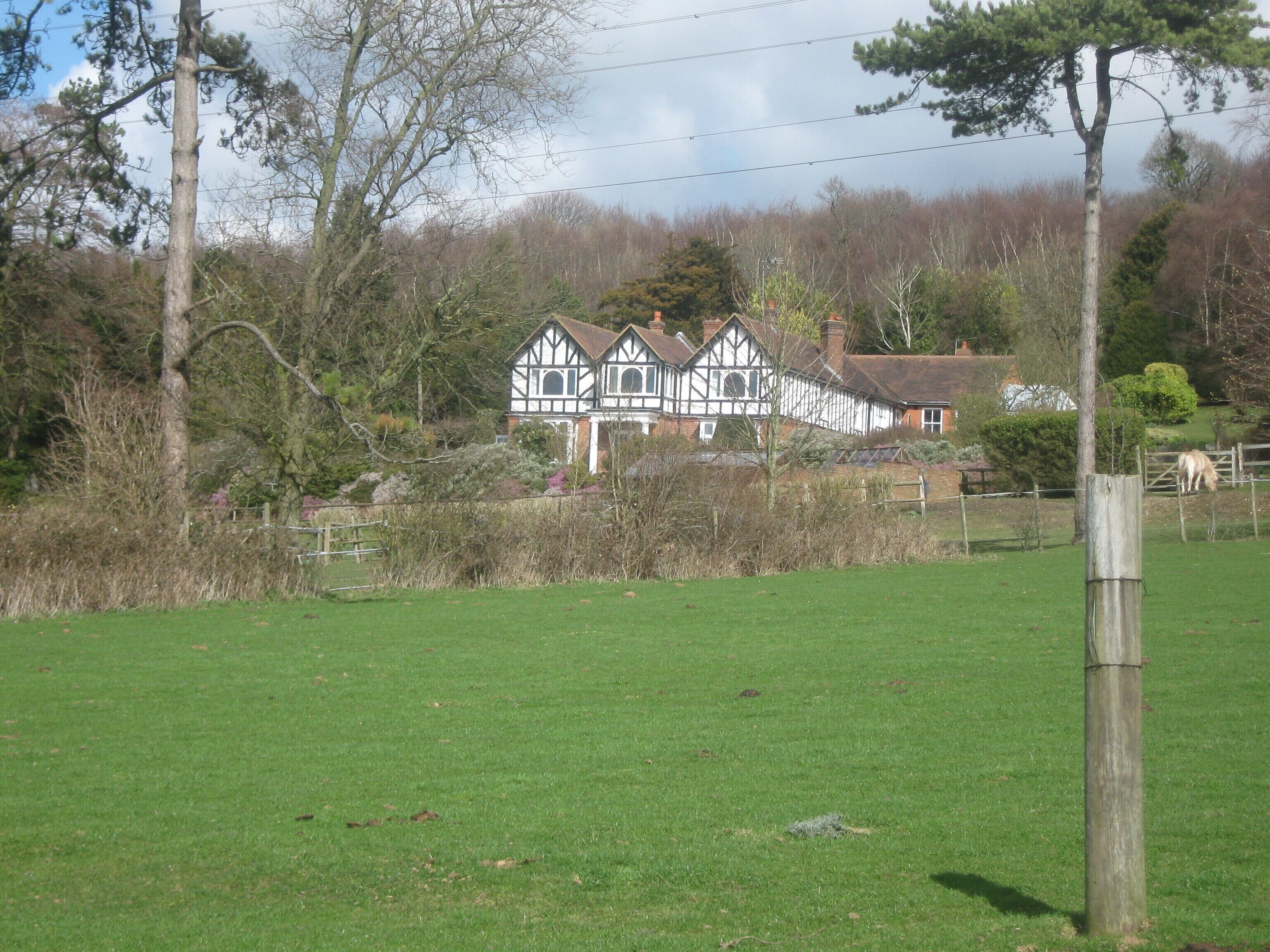 Gorsley House As seen from a footpath from Woodgate towards Pett Bottom. Gorsley Wood is in the background.