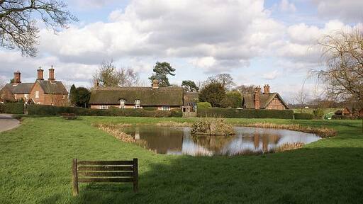 Osmaston village pond Looking across Osmaston village pond towards some thatched cottages.