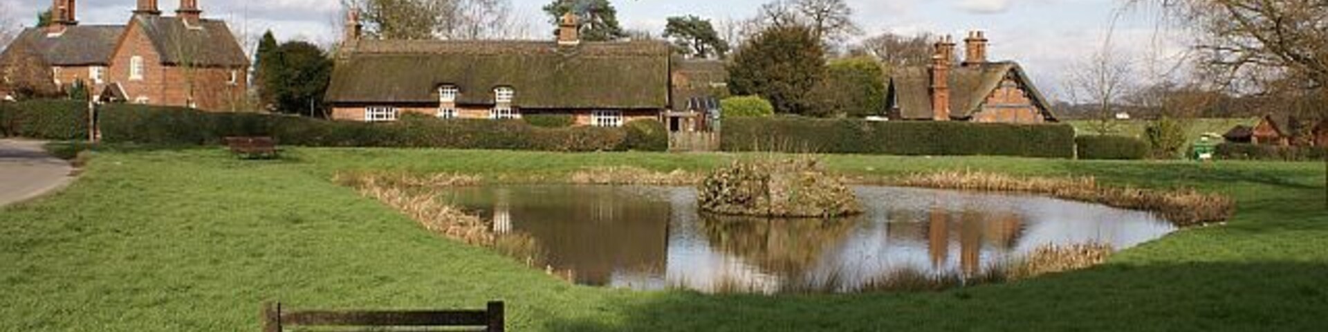 Osmaston village pond Looking across Osmaston village pond towards some thatched cottages.