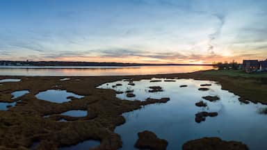 Aerial panoramic view of a beautiful sunset by the Cocagne River. Taken in New Brunswick, Canada.