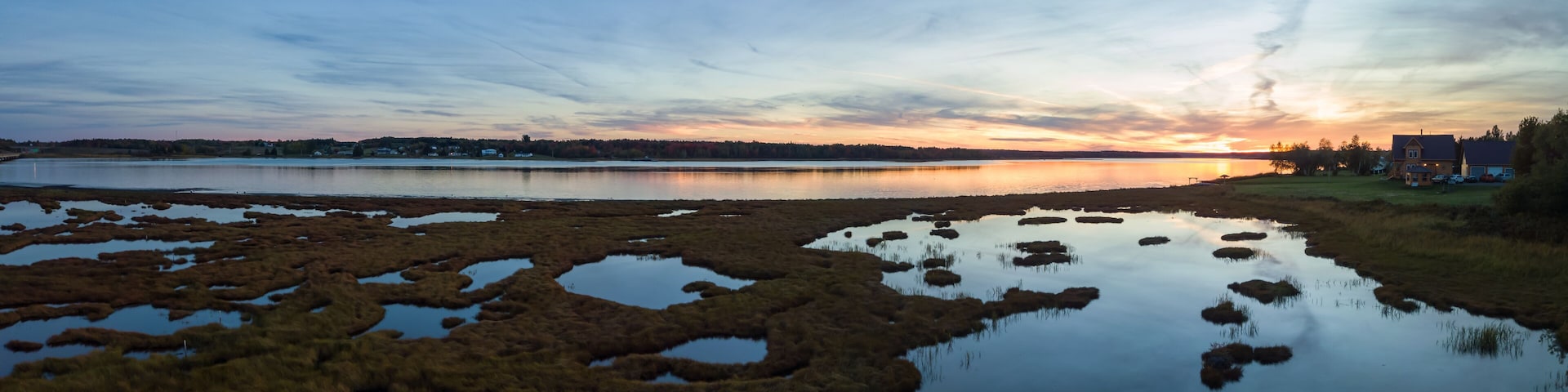 Aerial panoramic view of a beautiful sunset by the Cocagne River. Taken in New Brunswick, Canada.
