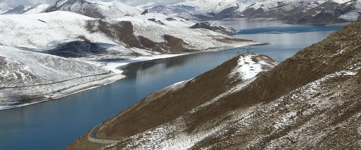 The Brahmaputra River is one of the last largely free-flowing rivers emanating from the Tibetan Plateau. Originating as the Yarlung Tsangpo River, it flows across southern Tibet through the Himalayas and into India and Bangladesh before merging with the Ganges and emptying into the Bay of Bengal.