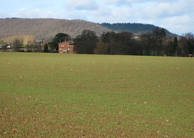 View of Burghill Court For details of the history of the house, click http://www.smr.herefordshire.gov.uk/hsmr/db.php?smr_no=31147 In the distance are Credenhill Park Wood and Round Oak Hill.