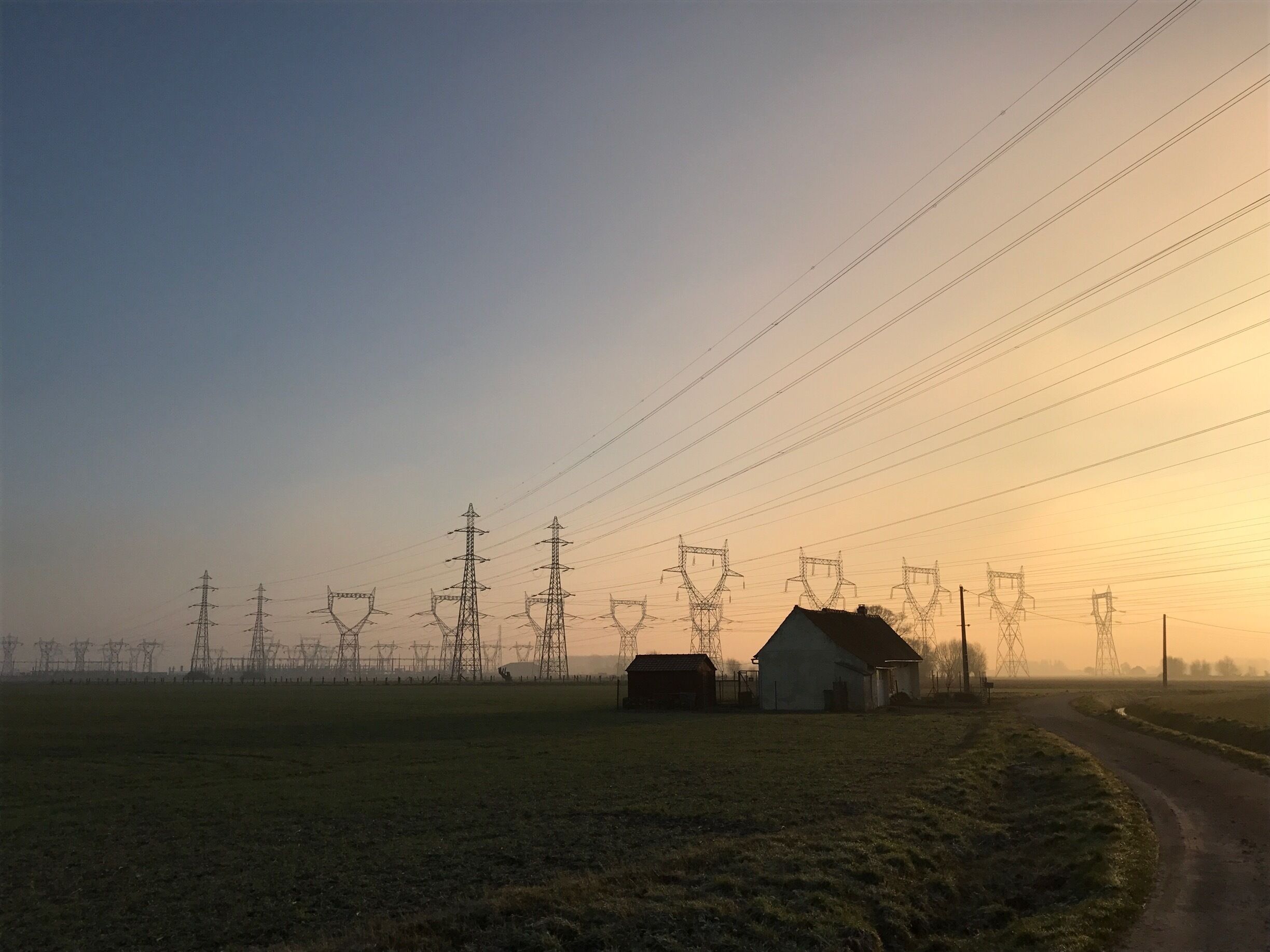 It was a special day with strange sunlights. This house is totally alone but link with the world by electric cables. The border between each is represented by the cables and the different  color of each side. North is the last place in France where you are hit by the sadness of post industry povrety.  
