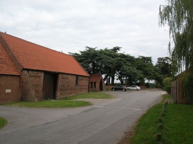 Farm in Nether Poppleton The nearest building is a farm, and just beyond that is the entrance to the church.