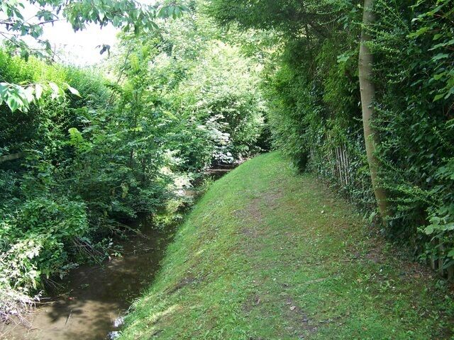 Footpath, East Chisenbury The footpath passes beside a small tributary of the River Avon.