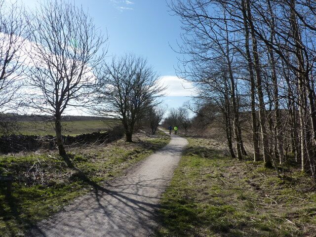 Two cyclists going south from Sparklow Near the north end of the High Peak Trail there is a car park; these two bikers have just set off with a strong tail wind. They will regret this on the way back!