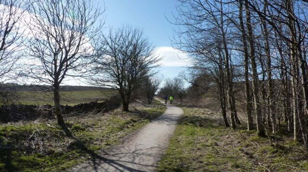 Two cyclists going south from Sparklow Near the north end of the High Peak Trail there is a car park; these two bikers have just set off with a strong tail wind. They will regret this on the way back!