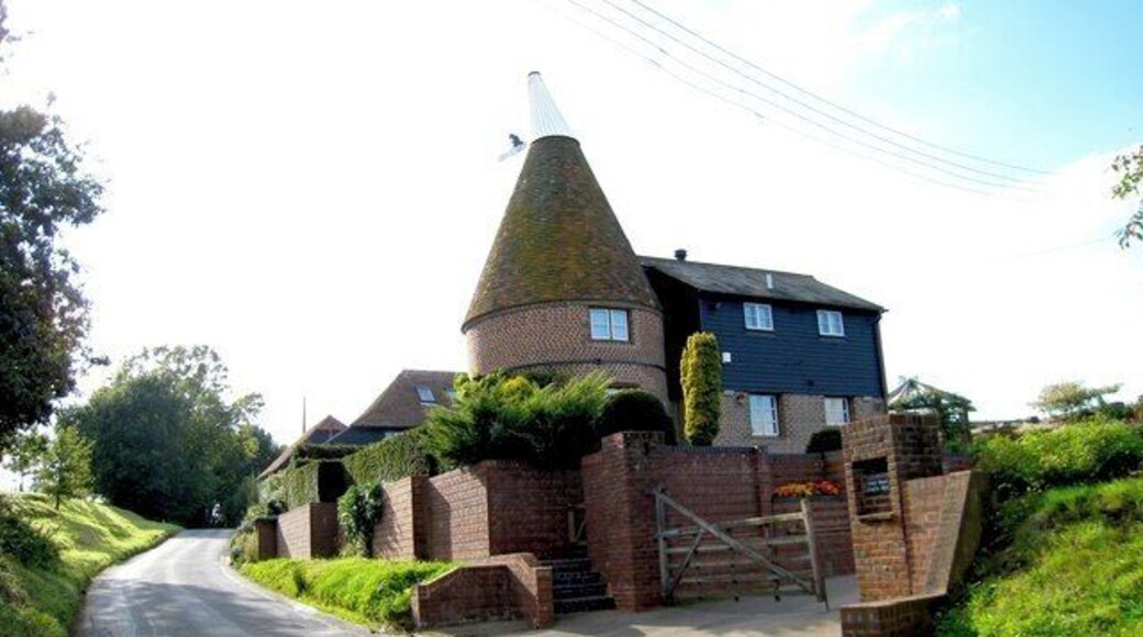 Catt Oast, Catt's Hill, Stone In Oxney, Kent. Single round kiln oast house, converted in 1984. The vane icon on the cowl depicts a cat inspecting its paw 1509964 Keywords: cat, roundel, conversion, hop drying, beer, black weatherboard, cowl