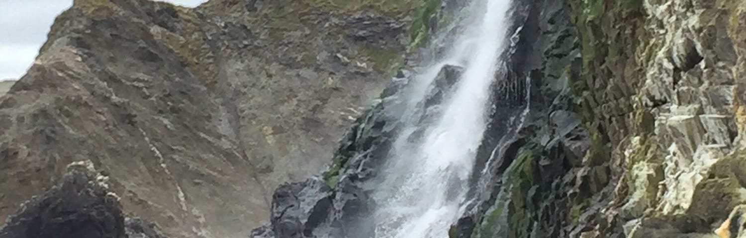A stroll along the beach led to a clamber across the rocks which led to stumbling into this gorgeous waterfall running into the sea!