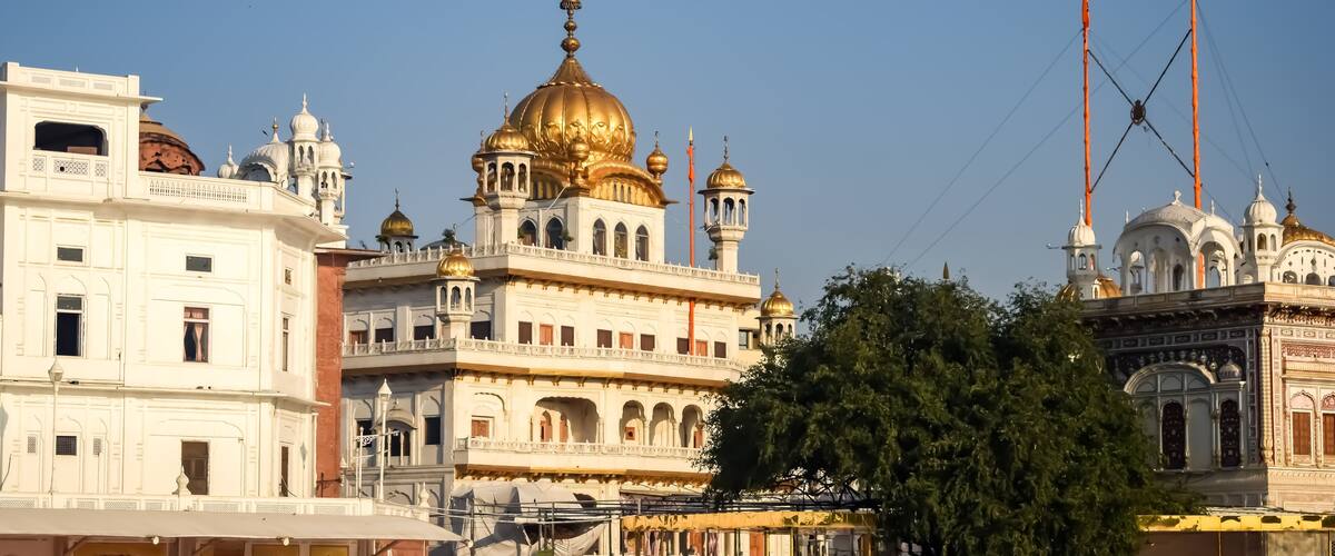 A historic building with ornate architecture, including domes and spires.