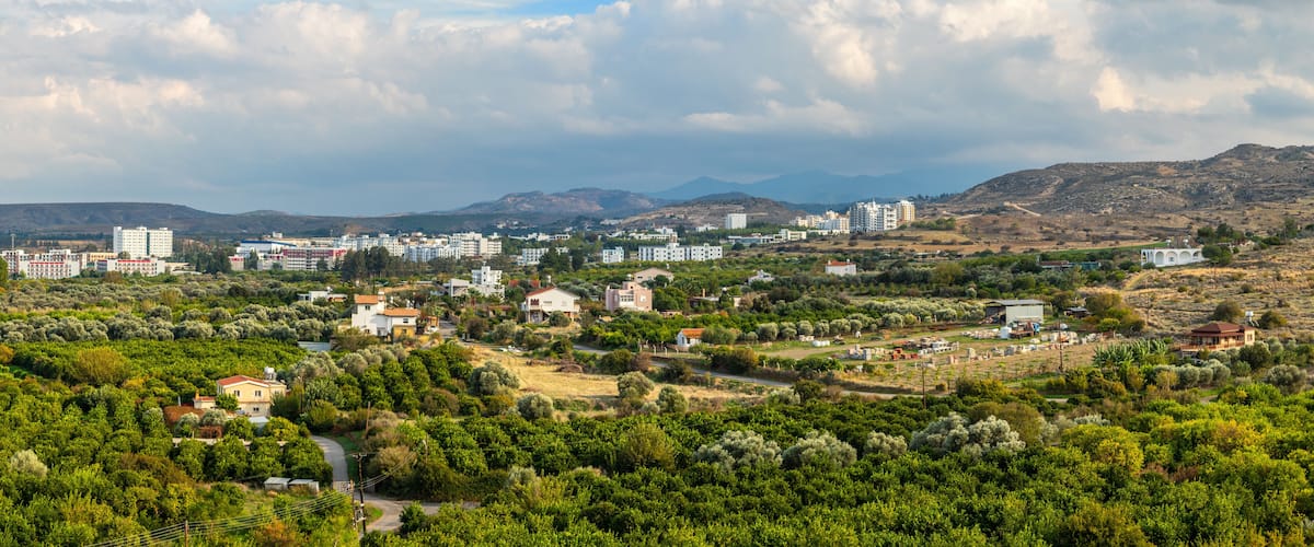 Lefka town panorama with modern buildings and green residential suburbs, Northern Cyprus