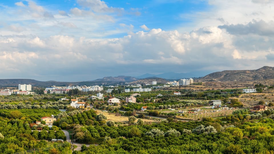 Lefka town panorama with modern buildings and green residential suburbs, Northern Cyprus