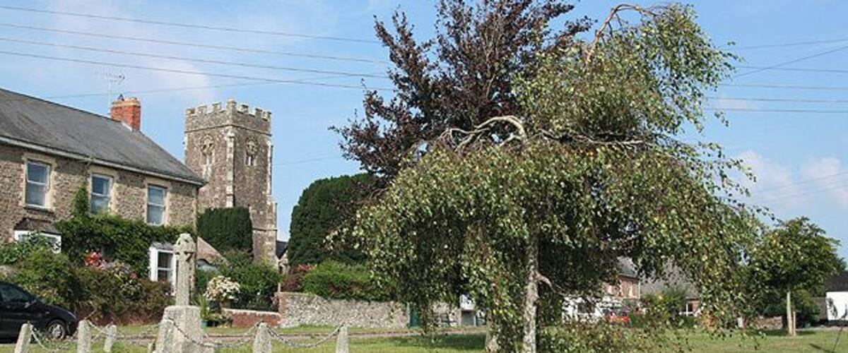 Coldridge: village green. The church is dedicated to St Matthew, but between 1742 and the late 19th century it was St Marys. Out of shot, on the south side of the green are The Old Post Office and The Old Bakery indicating that the village was a little more self-sufficient in earlier times. Looking east-north-east