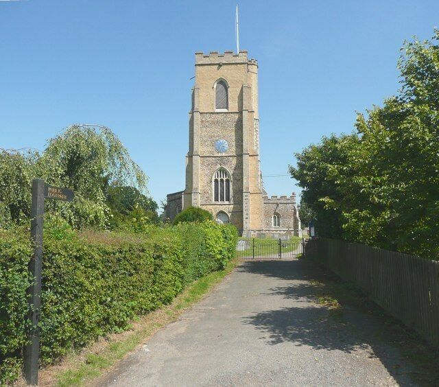 Entrance to churchyard, Church Lane, Ridgewell From the end of Church Lane this broad path leads into the churchyard. It is also a public footpath, and the lettering on the sign has been coloured gold.