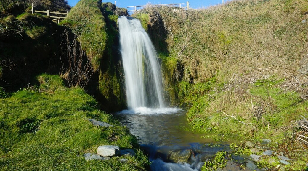 On the beach there is a waterfall, which can only be seen after heavy rain fall. There is a great walk through some woods from the main car park by the church to get to this amazing crescent shape cove where you will find this waterfall. A pebble beach offers a great swimming area and a quite place to take some great pictures.