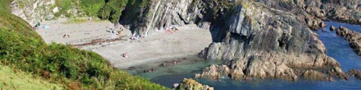 Lansallos Cove This sheltered cove is seen here from the coast path to the west of the cove.