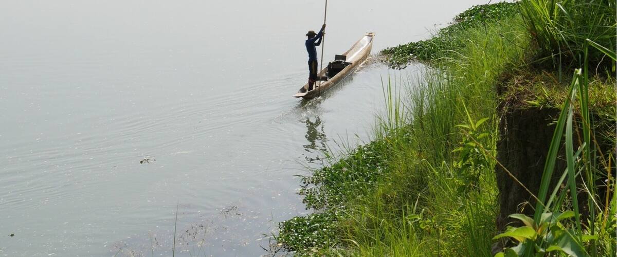 Our dugout/canoe poling back after dropping off myself and my guides for our half day jungle trek in Chitwan National Park.