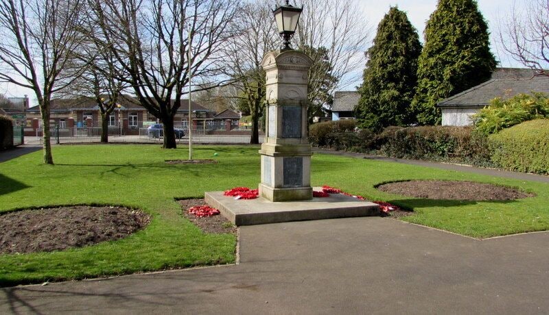 North side of Caerleon War Memorial. Now located in the Memorial Garden near the town hall, the War Memorial was erected in 1921 in the square at the junction of High Street and Cross Street. It was relocated here in 1966.