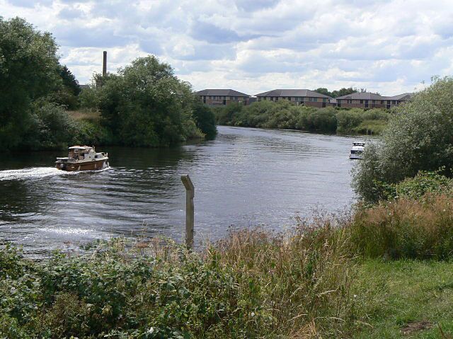 Cruising on the Trent. Alongside the Colwick Industrial Estate. The buildings behind are the Colwick Quays business park.