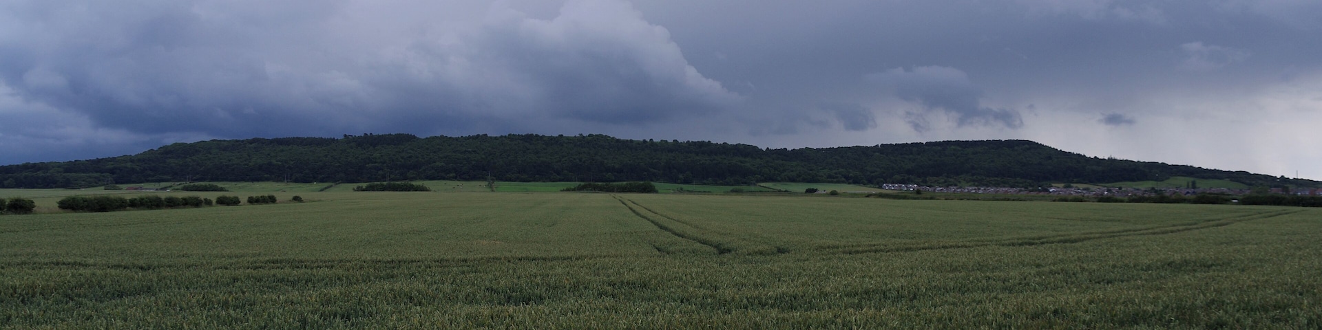 A rainstorm rolls in over the hills visible from Longbeck station.