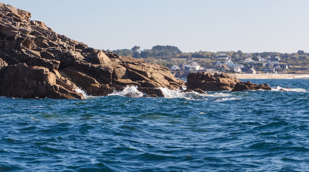 Coast in Brittany with Primelin village and breakwater in the background