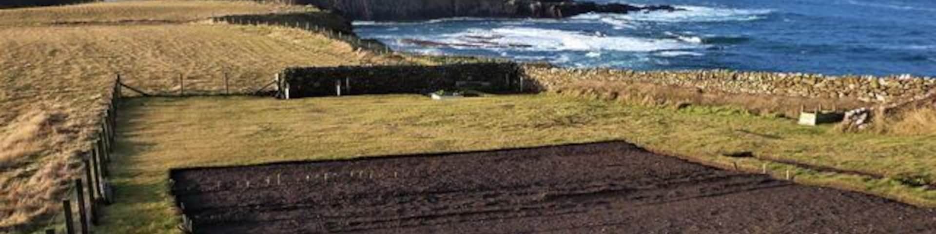 Kirtomy Bay Looking West with Kirtomy Bay in the middle ground and Farr Point in the background.