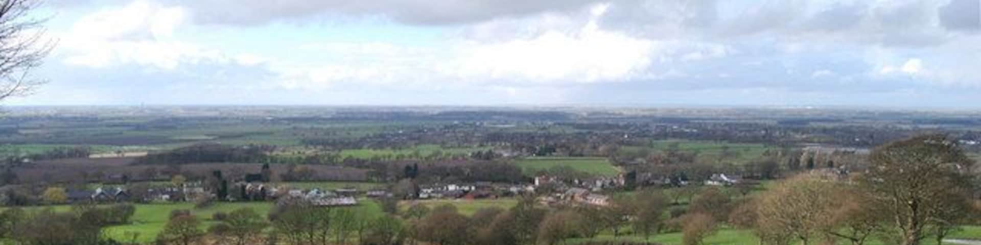 View from Hunters Hill The village in the near distance is Hill Dale near Parbold and the view beyond is north west across the west Lancashire Plain.