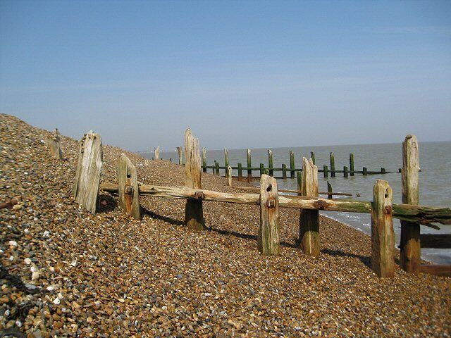 One of many old groynes The force of the sea (at times) is clearly illustrated here by the steepness of the shingle bank.