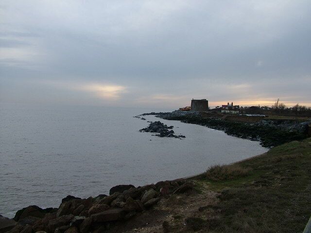 Defences for defences, East Lane, Bawdsey Not long ago this Martello tower was far from the sea, but now it needs major works to protect it, and the nearby house, from erosion. Rocks are not a natural feature of Suffolk.