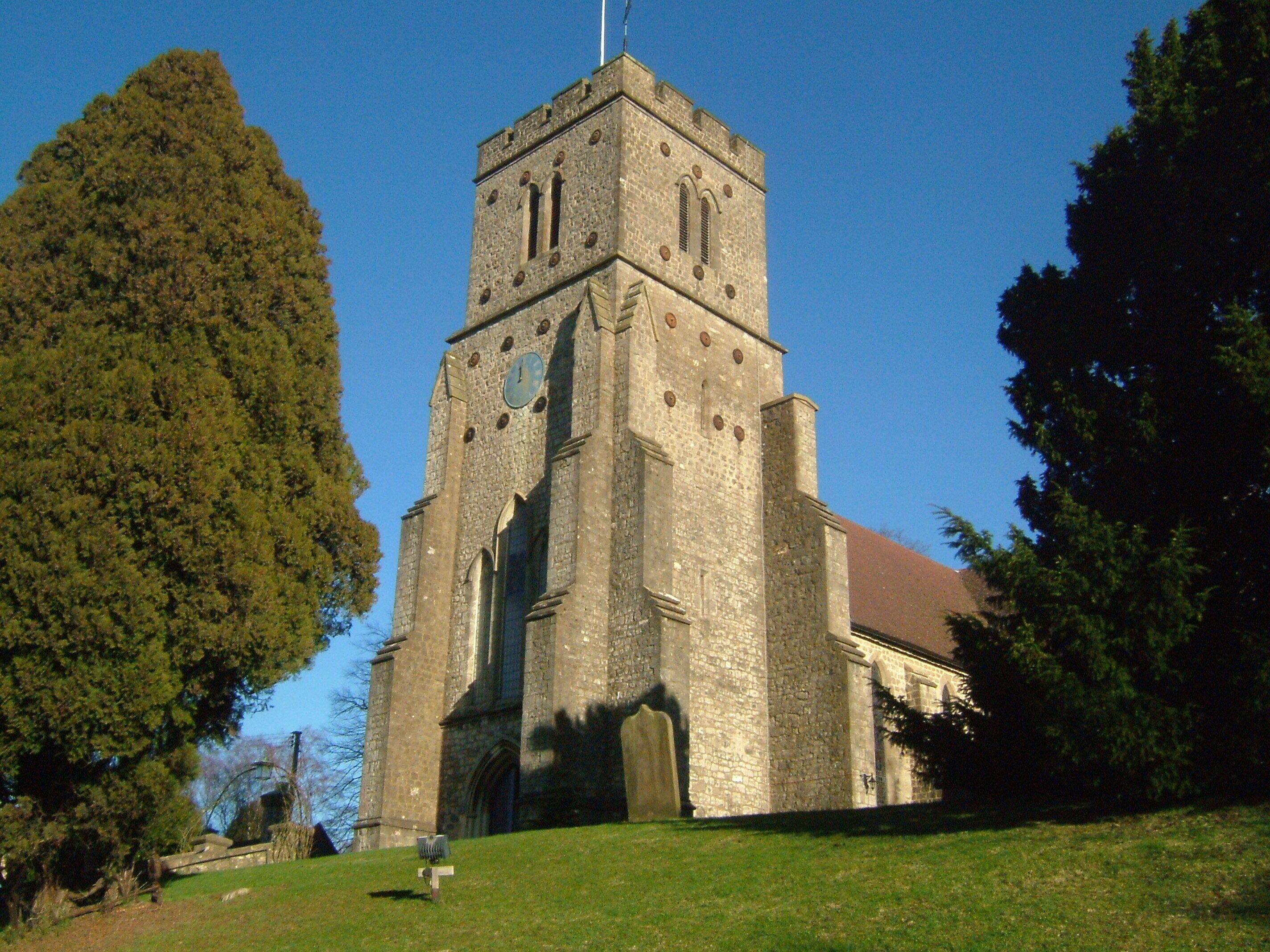 A historic church with a tall tower and arched windows.