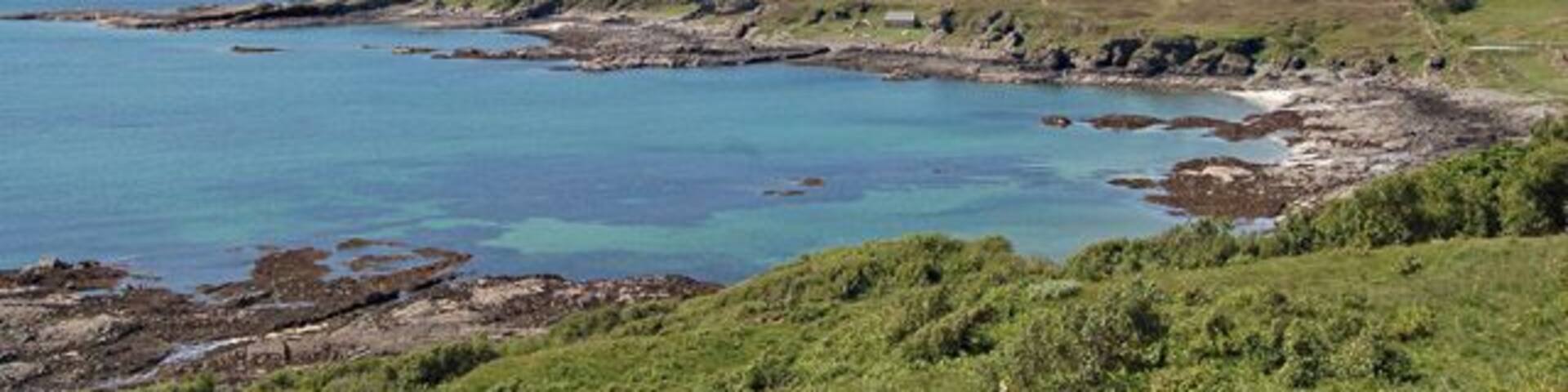 Tarskavaig Bay Looking a touch tropical on a warm May day. In the distance is the Cuillin.