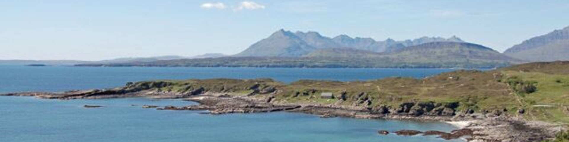 Tarskavaig Bay Looking a touch tropical on a warm May day. In the distance is the Cuillin.