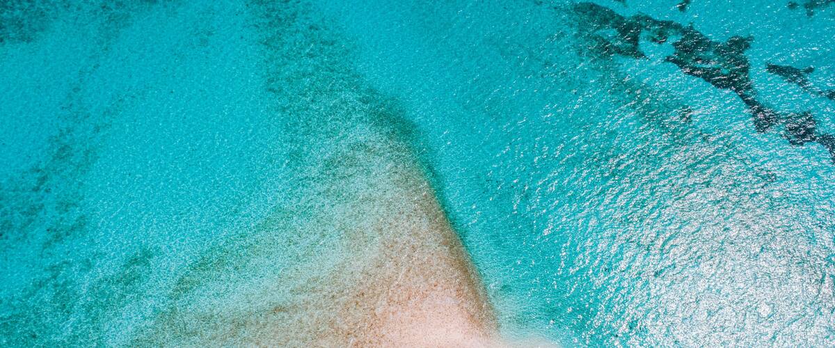 boat anchored Private Mermaid tail shaped Island in Florida Keys