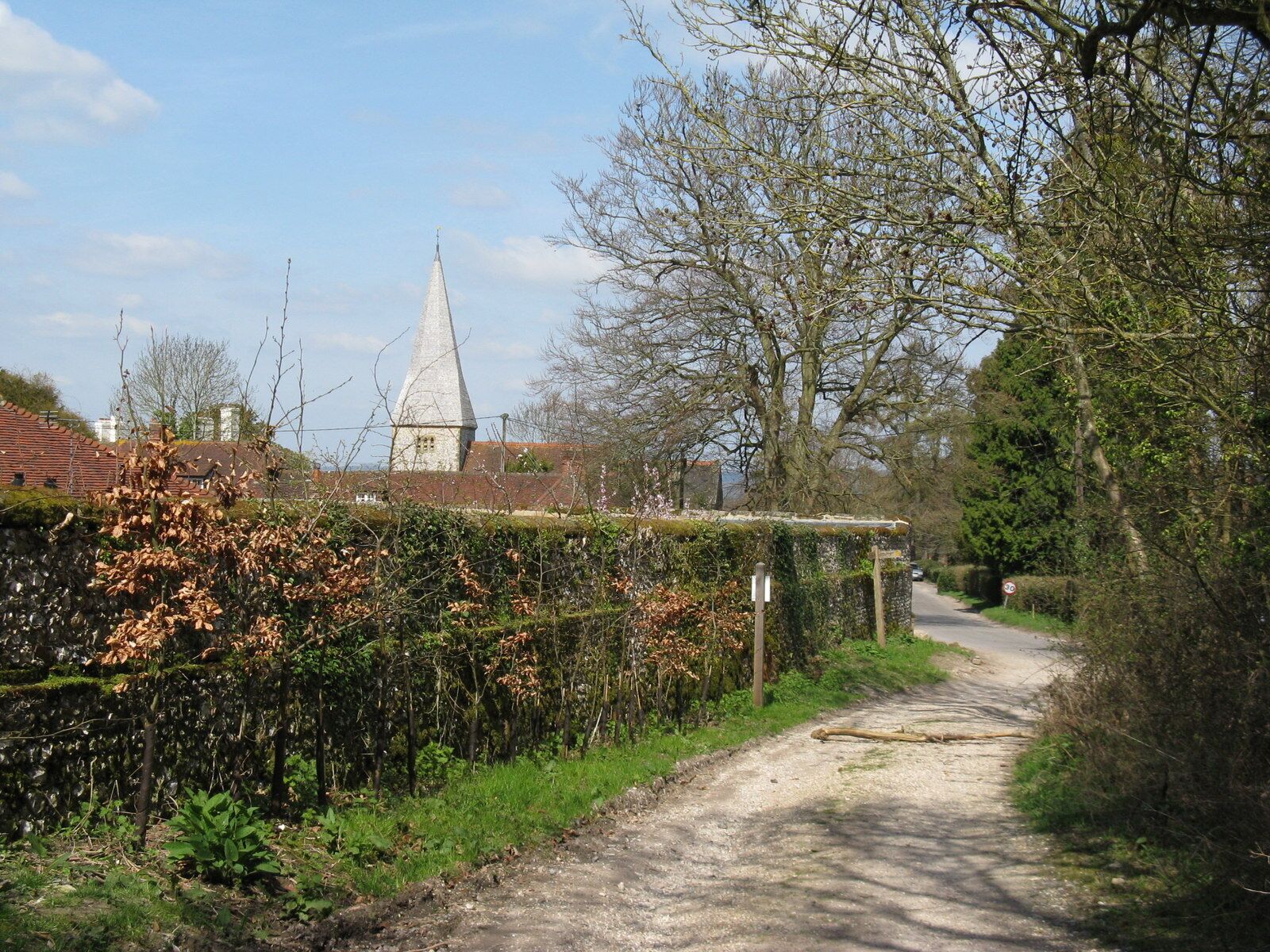 Road and byway junction at Graffham The spire of St Giles church is in the background.