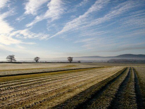View of Dodleston Fields and Welsh Hills View of farmland and Welsh Hills taken from public footpath opposite Dodleston Hall leading to Windmill Hill and Lower Kinnerton