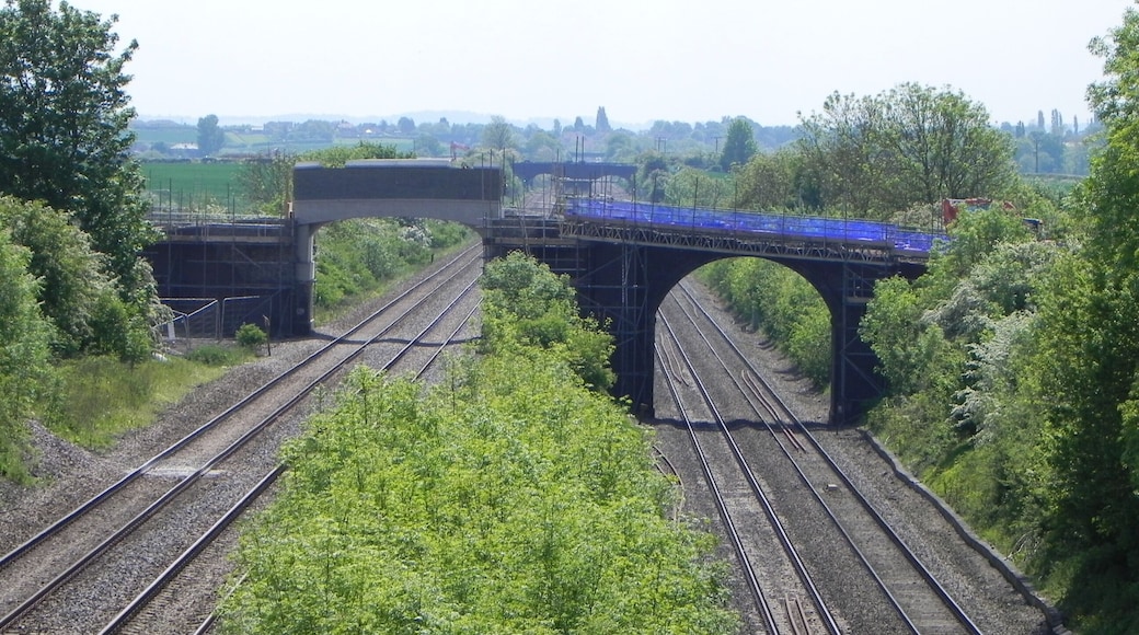 Road bridges over the Midland Main Line in Bedfordshire were replaced in 2014 to allow overhead electrification and the passage of larger rolling stock. Here is Peck's Bridge at Object location 52° 12′ 33″ N, 0° 31′ 35″ W View this and other nearby images on: OpenStreetMap - Google Earth 52.209167; -0.526389