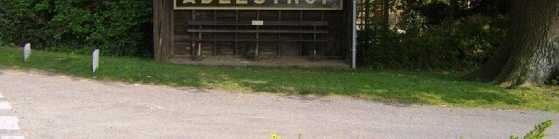 Adlestrop station sign in the bus shelter The sign is one of the old station signs. It was moved here after the station closed. The plaque on the bench contains the famous poem by Edward Thomas about Adlestrop. First line: "Yes, I remember Adlestrop. The train stopped there." Here is a link to the full poem. http://www.poetsgraves.co.uk/Classic%20Poems/Thomas%20E/adlestrop.htm The former railway station is here: 451139