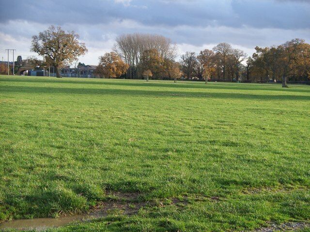 Along the Diamond Way The Diamond Way long distance path crosses this large field near Moreton-in-Marsh. The route is towards the little dark green shape to the right where a gateway leads to the minor road to Batsford. The bridge carrying the Fosse Way A429 over the London to Worcester main line railway can be seen at the extreme left of the image. This field is where the annual Moreton Show is held.